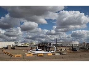 Oil storage containers and pipelines in Alberta. The Canadian government has signaled it may eventually lift the controversial cap on emissions from the oil and gas sector.