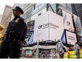 CoreWeave Inc. signage in Times Square in New York, US, on Friday, May 9, 2025. After a heavily scaled down initial public offering, CoreWeave Inc. is in discussions to raise about $1.5 billion in debt, according to a person with knowledge of the matter.