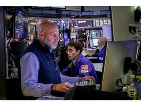 Traders work on the floor of the New York Stock Exchange.