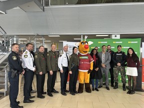 Michèle Létourneau, spokesperson for HGreg, Marouan BelFakir, community relations advisor for the Société de l'assurance automobile du Québec, and Jean-Sébastien Hamel, community relations officer for the Mascouche Police Service, are pictured here with their respective teams at the launch of Operation Red Nose on November 11, 2025.