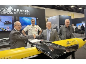 Nick Goodwin, Business Director, Asia Pacific at Kraken Robotics; Vice-Admiral Angus Topshee, Commander of the Royal Canadian Navy; Neil Hodges, Managing Director at BlueZone Group; and Roland Leyte, Business Development Manager at Kraken Robotics at the IndoPacific Maritime Exposition in Sydney, Australia.