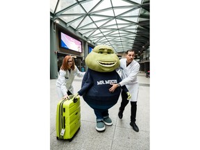 Mr. Mucus is escorted out of the train station by the Mucus Relief Crew