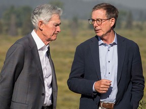 Federal Reserve Chairman Jerome Powell, left, speaks with Governor of the Bank of Canada Tiff Macklem outside of the Jackson Hole Economic Symposium in August.