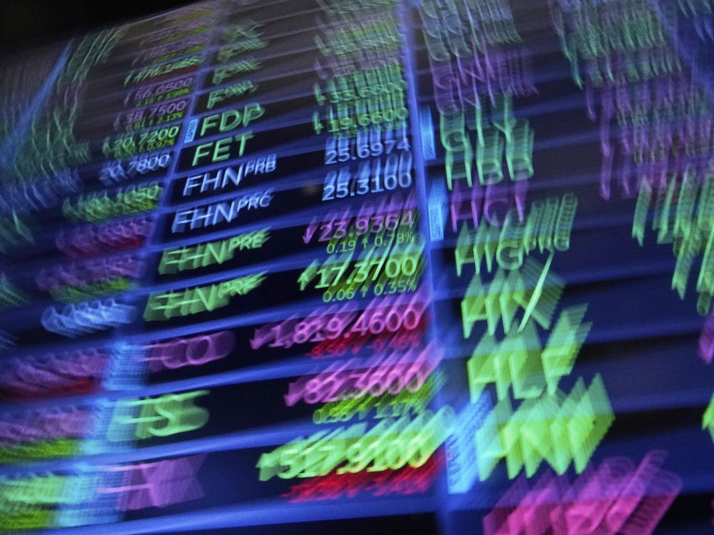 A board above the trading floor of the New York Stock Exchange with stock symbols is shown in this image on July 1, 2025.