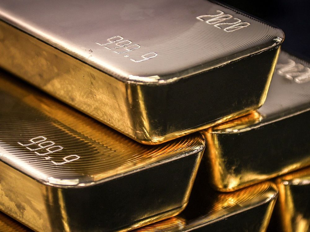 Gold bullion bars are pictured after being inspected and polished at the ABC Refinery in Sydney on August 5, 2020.