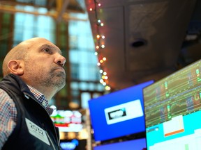 James Denaro works on the floor at the New York Stock Exchange in New York on Dec. 10, 2025.