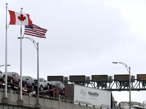 Commercial trucks cross the Lewiston-Queenston Bridge border crossing into the United States on February 04, 2025 in Niagara Falls, Canada.