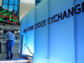 Traders work on the floor at the New York Stock Exchange in New York, Wednesday, Dec. 10, 2025.