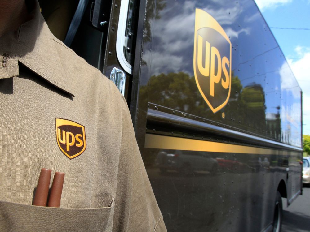 FILE - This April 25, 2011 file photo shows United Parcel Service driver Albert Palafox in Palo Alto, Calif.