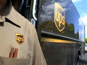 FILE - This April 25, 2011 file photo shows United Parcel Service driver Albert Palafox in Palo Alto, Calif.