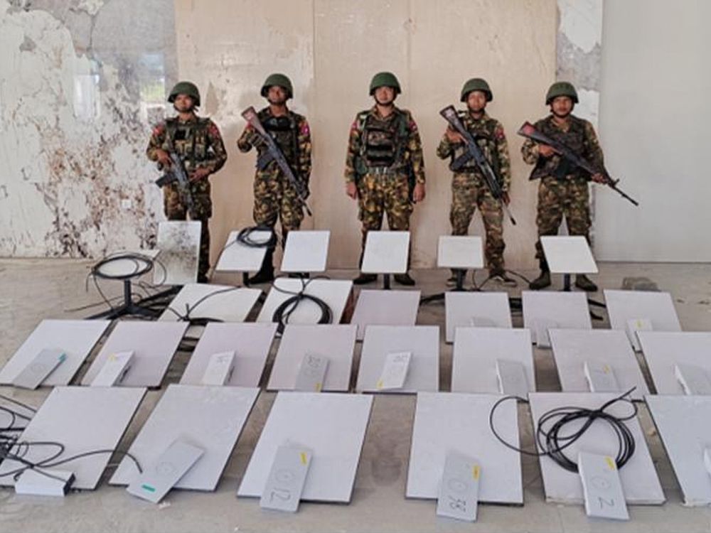 FILE - In this image provided by the Myanmar military on Oct. 19, 2025, soldiers stand next to Starlink satellite internet devices as they seize KK Park online scam center in Myawaddy township, Karen State, Myanmar.