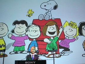FILE - Sony Corp. President Kenichiro Yoshida speaks as characters from Peanuts are shown at a press conference at the company's headquarters Tuesday, May 22, 2018, in Tokyo.