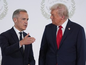U.S. President Donald Trump greets Prime Minister Mark Carney during a summit, Oct. 13, in Sharm El Sheikh, Egypt.