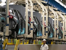 An autoworker stands on the vehicle assembly line at Canada Manufacturing Plant 2 in Alliston, Ontario.