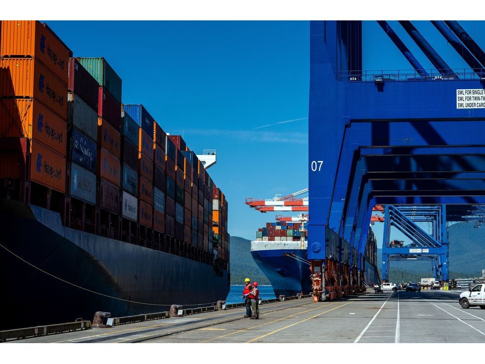 Mooring crews prepare to tie up a container ship arriving at the Fairview Container Terminal in the Port of Prince Rupert in Prince Rupert, British Columbia.