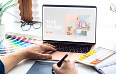 Web design desktop with laptop and tools