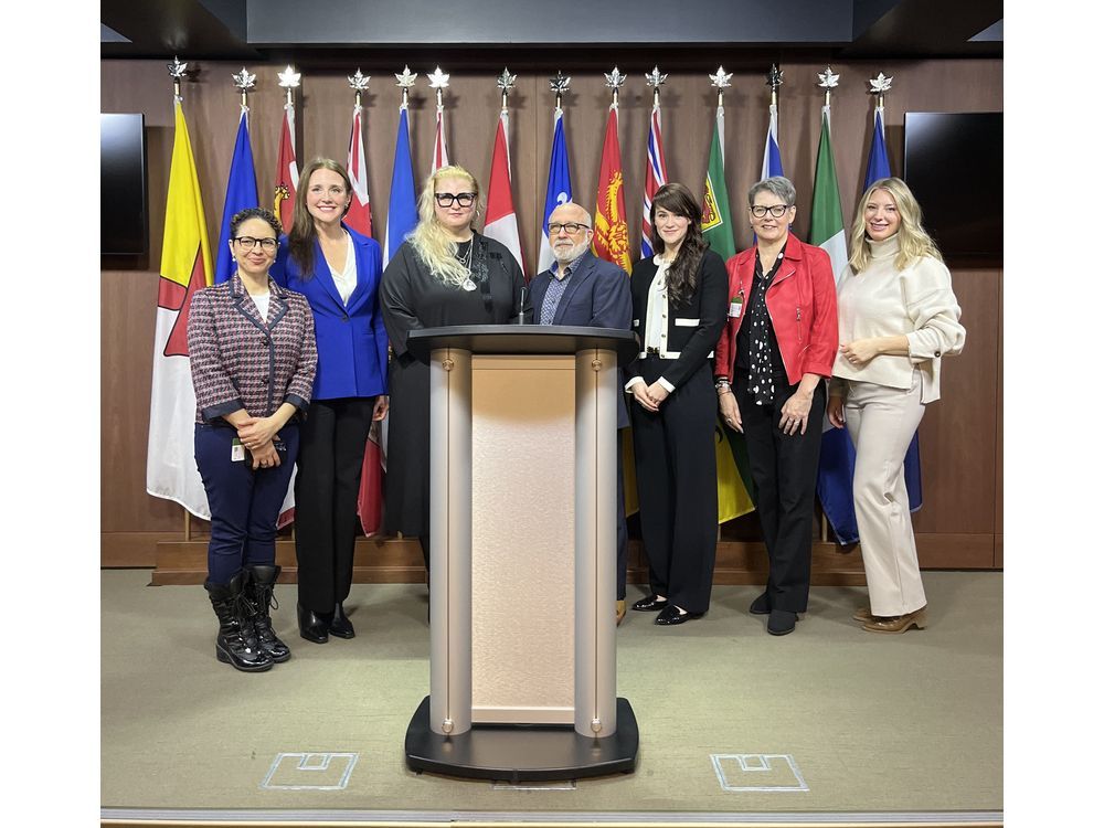 SAC CEO Luciana Nechita and CAOT CEO Irving Gold (centre) pictured with their respective teams after the press release at Parliament Hill.