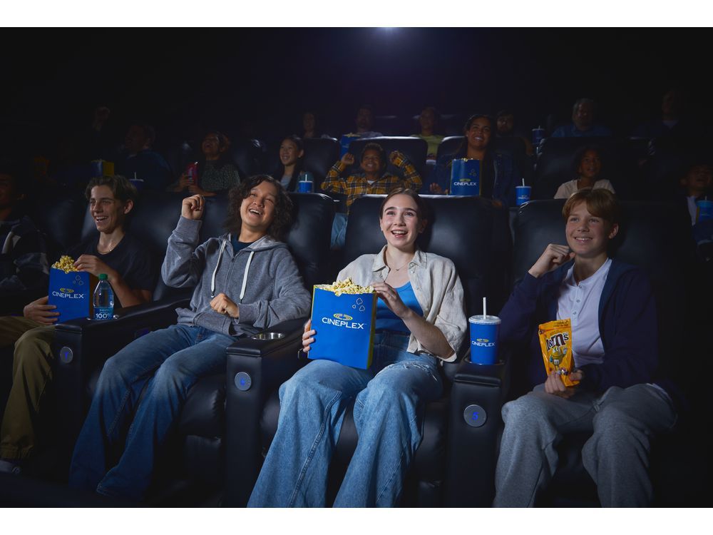 Friends at Cineplex watching a movie, enjoying snacks and drinks