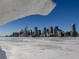 A snow-framed view of the Toronto skyline from the end of Polson St. on January 29, 2022.