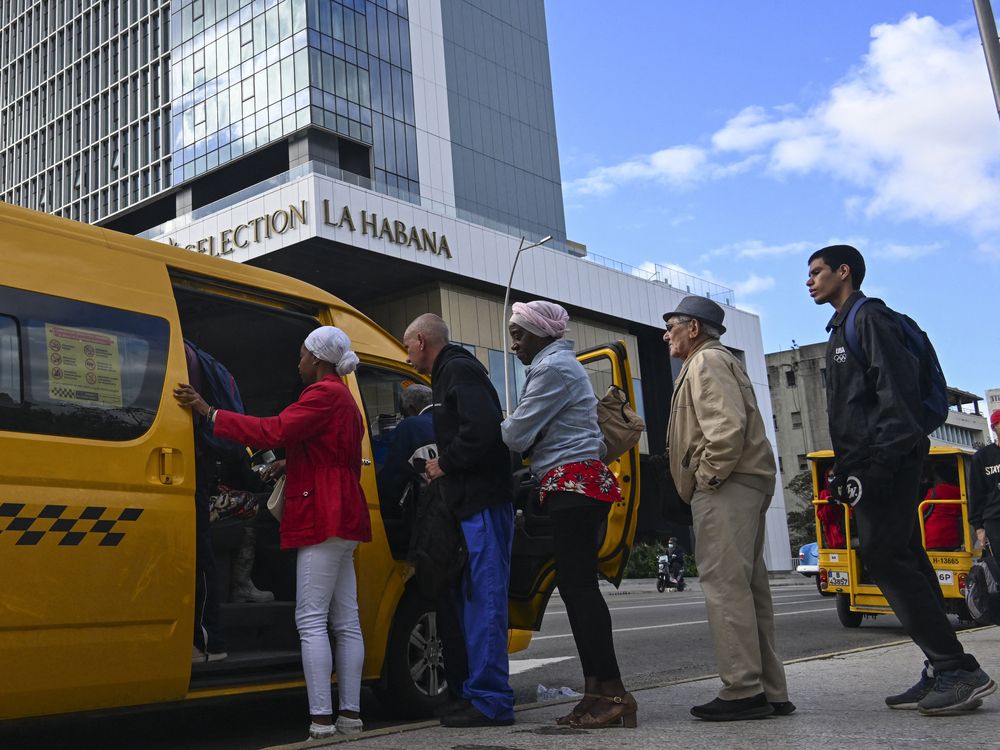 Cubans queue to board a public-transport minibus near the Iberostar Selection La Habana Hotel in Havana on February 2, 2026.