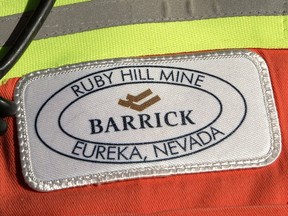 In this Feb. 14, 2006 file photo, a close-up of the chest patch of a worker at Barrick's Ruby Hill Mine, outside Eureka, Nev., is shown.