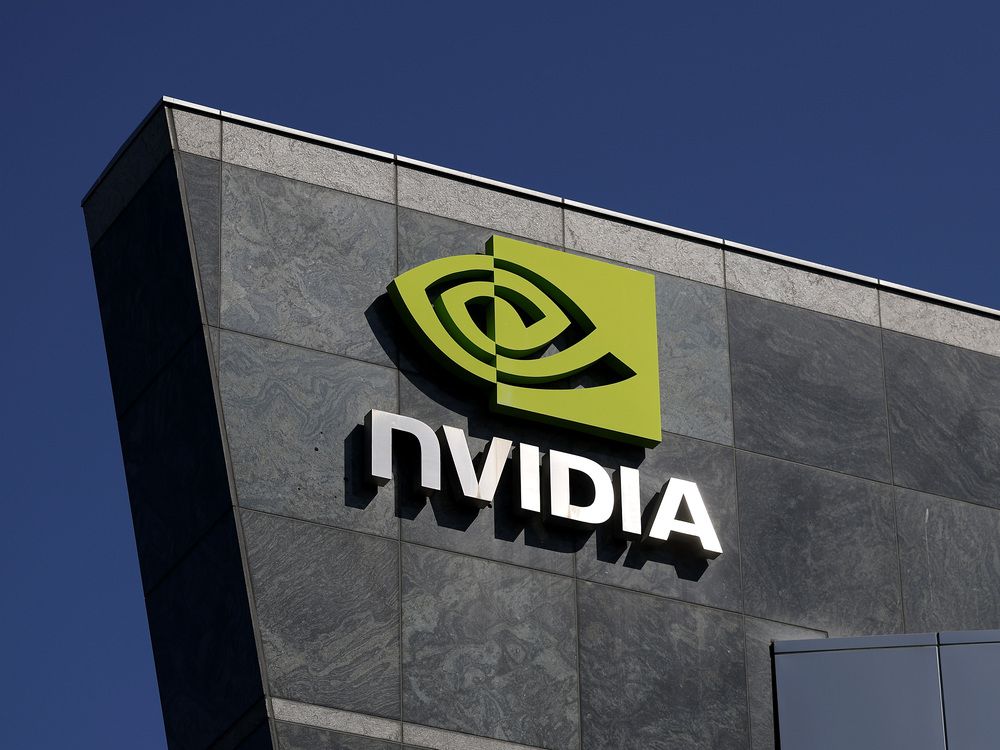The Nvidia logo is displayed on a building at Nvidia headquarters on August 27, 2025 in Santa Clara, California