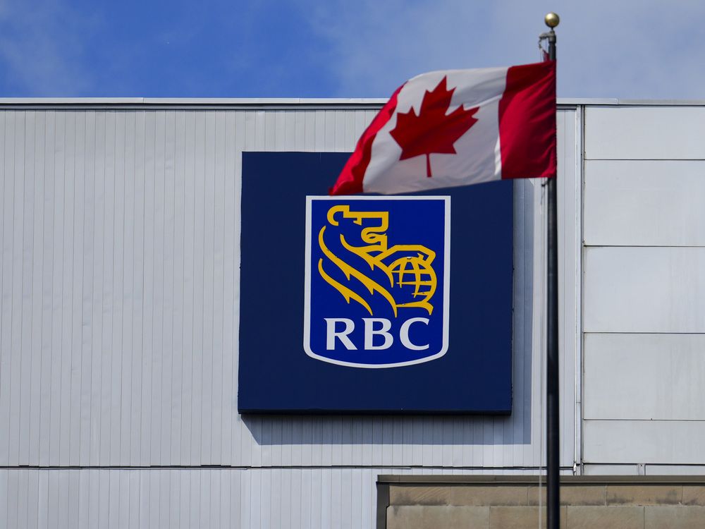 A Royal Bank of Canada sign and a Canada flag are pictured in Ottawa on Thursday, June 27, 2024.