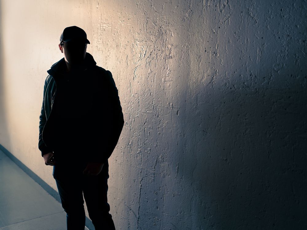 Suspicious man. Silhouette of criminal. Stalker or anonymous stranger.