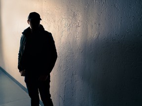 Suspicious man. Silhouette of criminal. Stalker or anonymous stranger.