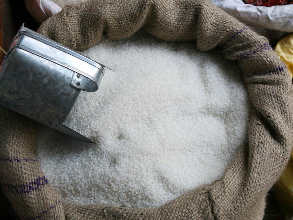 White sugar is displayed in a sack