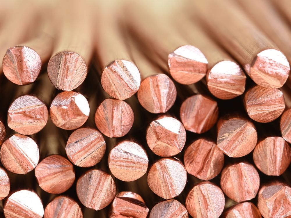 A close up of a stack of copper wire, manufactured for use in electric power cables.
