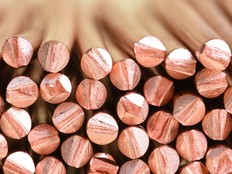 A close up of a stack of copper wire, manufactured for use in electric power cables.