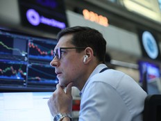 Traders work on the floor of the New York Stock Exchange during morning trading on February 24, 2026 in New York City