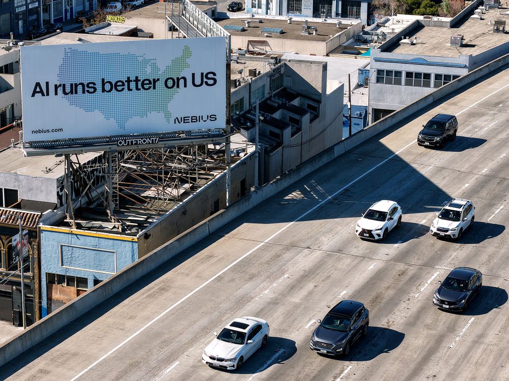 In an aerial view, a billboard advertising an artificial intelligence (AI) company is posted on September 16, 2025 in San Francisco, California
