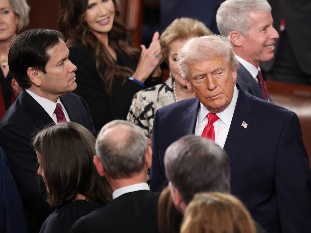 U.S. President Donald Trump, with Secretary of State Marco Rubio (L) and Supreme Court justices looking on, arrives for his State of the Union address during a Joint Session of Congress at the U.S. Capitol on February 24, 2026