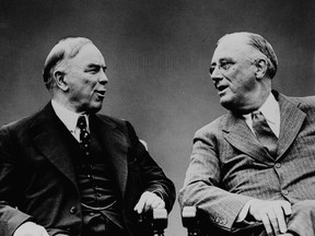 Canadian Prime Minister William Lyon Mackenzie King (left) and U.S. President Franklin D.Roosevelt talk at the Quebec Conference in Quebec City in an Aug. 1943 file photo.