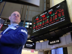 Stock market numbers are displayed as traders work on the floor of the New York Stock Exchange during morning trading on March 10, 2026 in New York City.