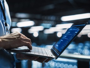 Data Center Programmer Using Digital Laptop Computer, Maintenance IT Specialist