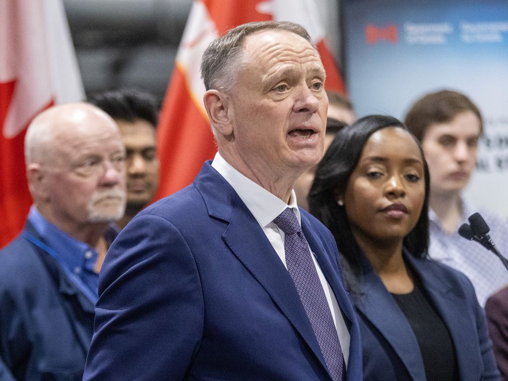 Defence minister David McGuinty, flanked by London MP’s Peter Fragiskatos and Arielle Kayabaga and Cheryl Hacking the CEO of IMT Precision in Ingersoll announcing a $306.4 million investment in a new plant with over 300 jobs coming to Ingersoll.