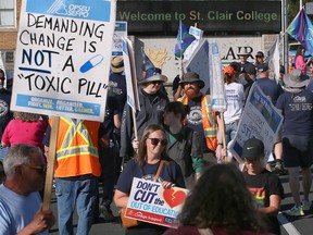 Striking St. Clair College workers and union supporters are shown at the entrance to the college on Cabana Road on Thursday, October 2, 2025 during a day of action event.