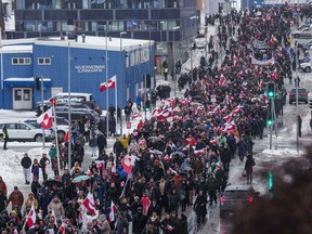 A crowd walks to the U.S. Consulate to protest against President Trump's policy towards Greenland on Jan. 17, 2026, in Nuuk, Greenland.