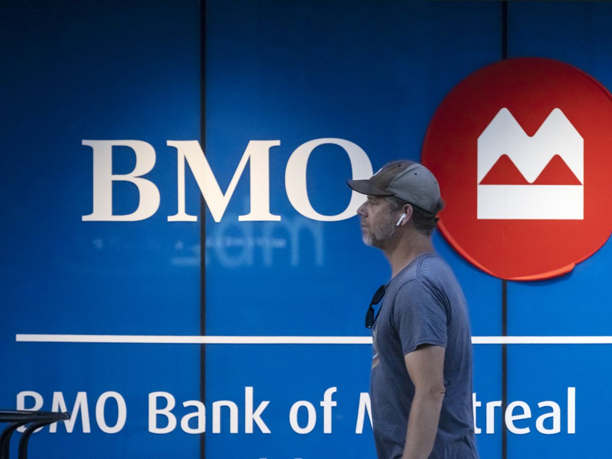 A person walks past Bank Of Montreal signage on Toronto’s Bloor Street, Monday October 2, 2023.