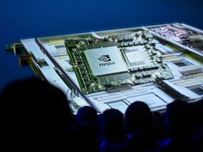 A chip of Nvidia is seen on screen as part of the supercomputer Jupiter during the inauguration of Europe's fastest supercomputer Jupiter on September 5, 2025 at the Supercomputing Centre in Juelich, western Germany.