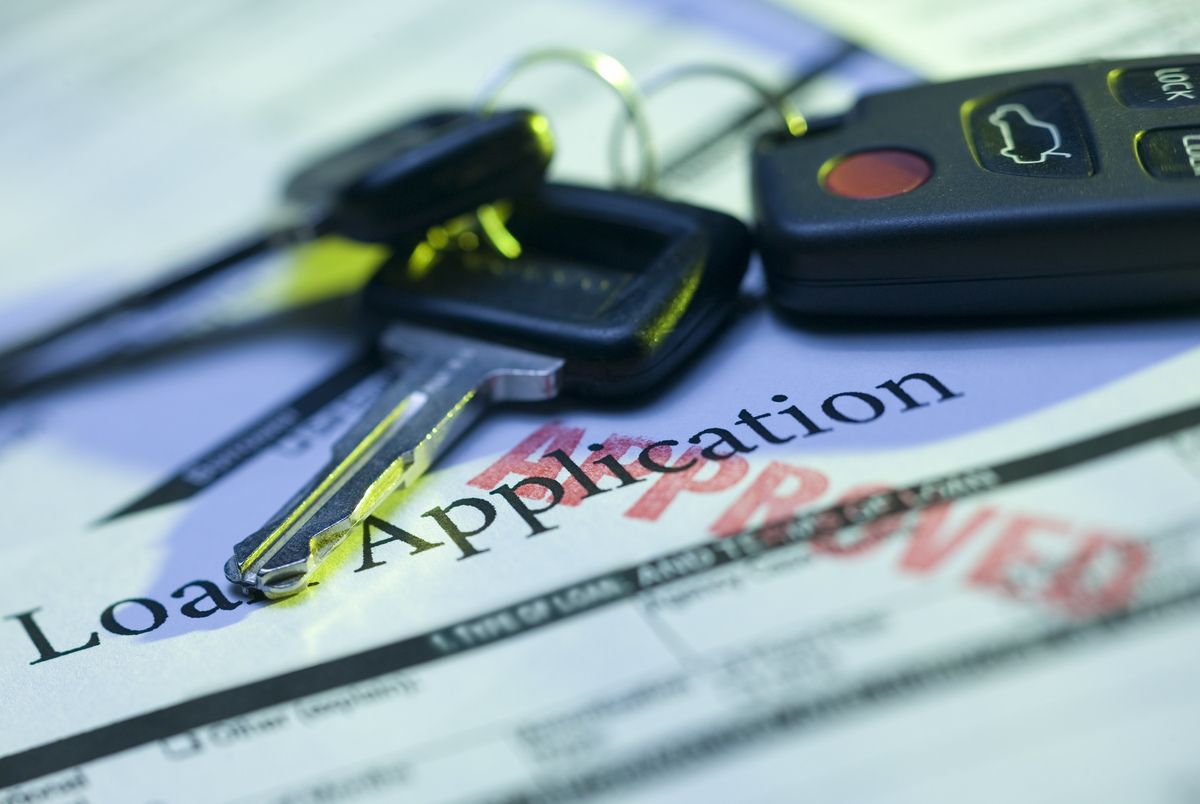 Car keys and approved loan application