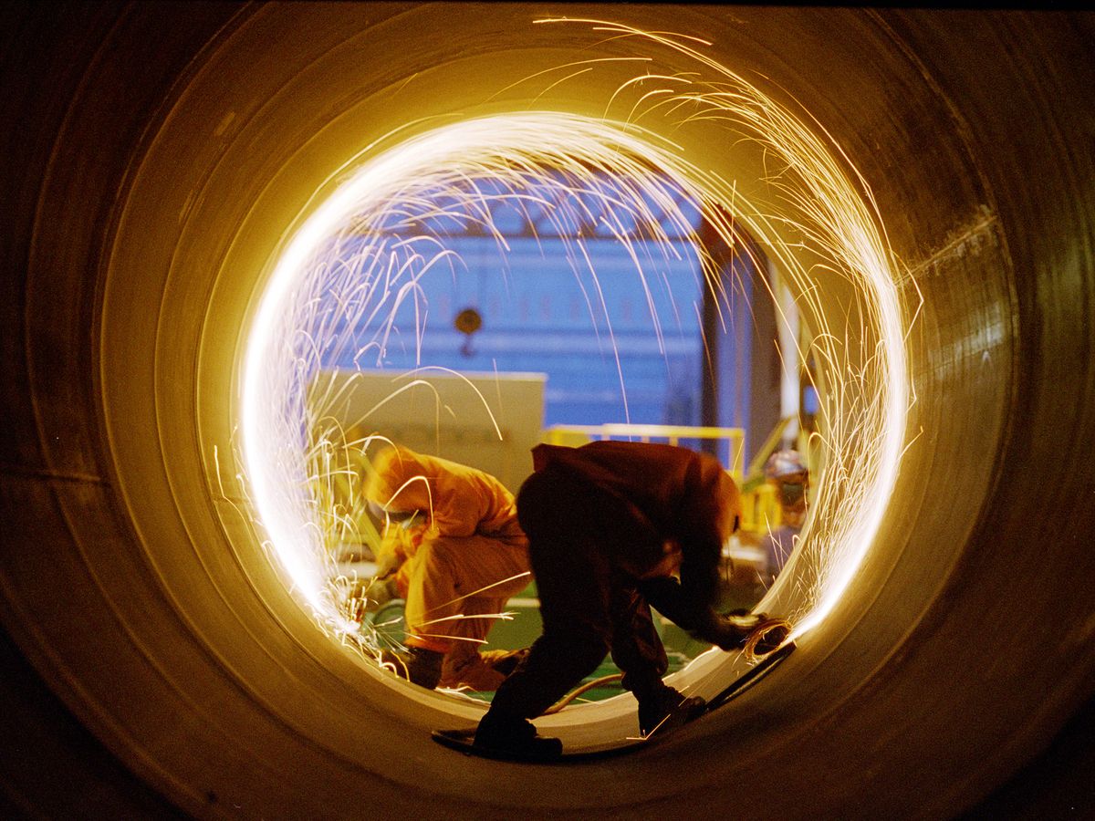 Hanwha workers are shown here building a KSS-III.