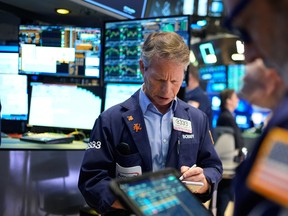 Bobby Charmak works on the floor at the New York Stock Exchange in New York on March 25, 2026.