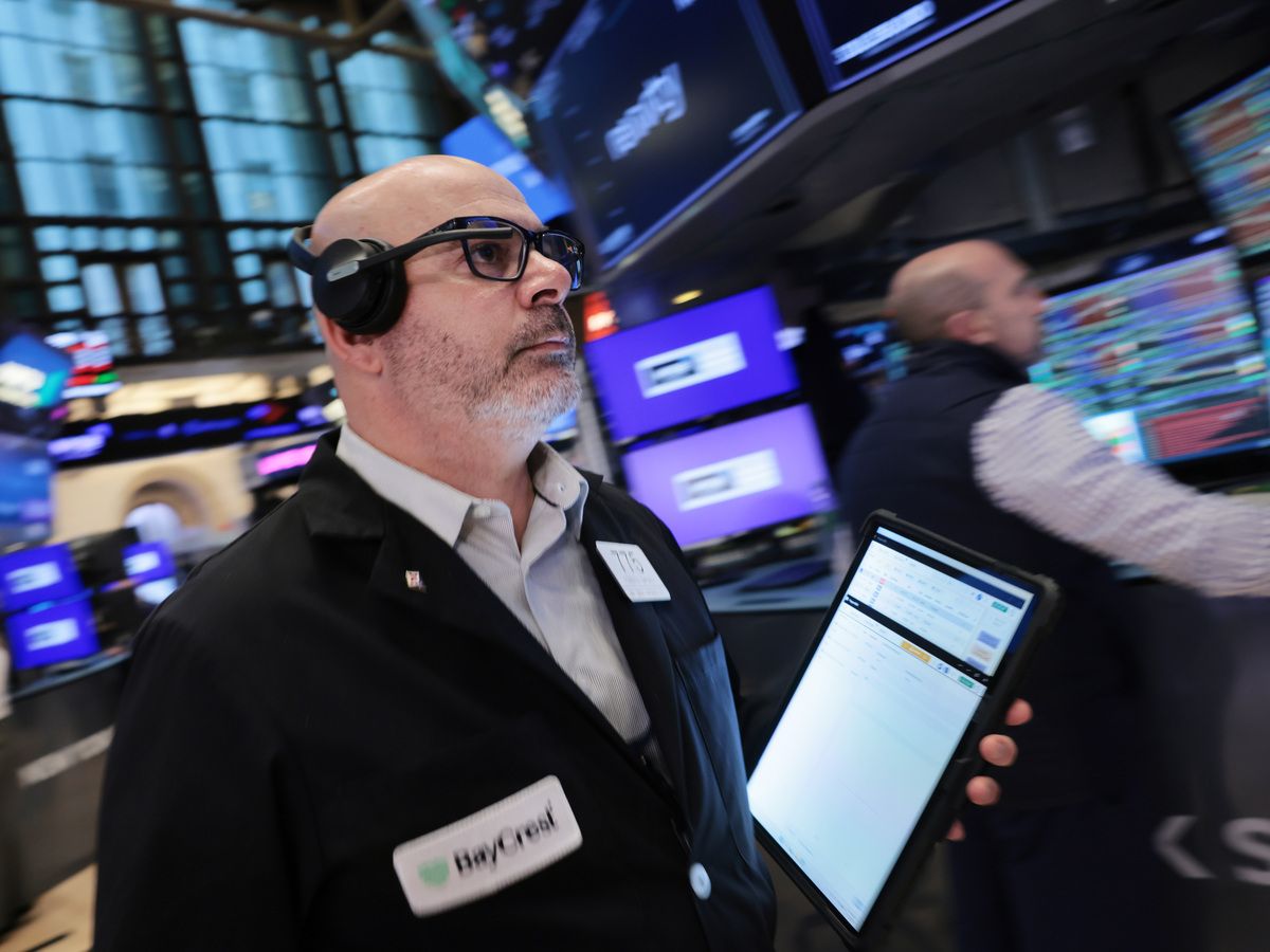 Traders work on the floor of the New York Stock Exchange (NYSE) on March 27, 2026 in New York City.