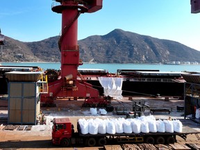 Fertilizer is unloaded from a ship at the port in Lianyungang, in China's eastern Jiangsu province on March 19, 2026.
