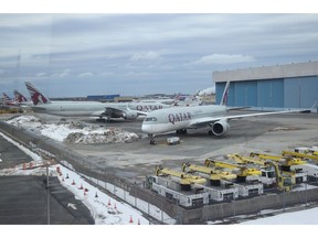 Qatar Airways planes parked at John F. Kennedy International Airport in New York.