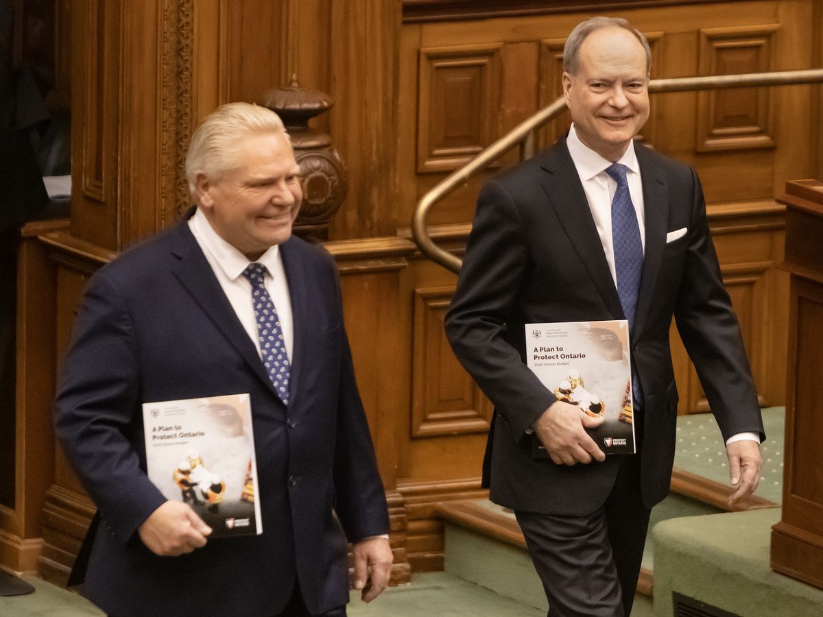 Ontario Premier Doug Ford, left, and Finance Minister Peter Bethenfalvy arrive to announce the 2026 budget at Toronto’s Queens Park on March 26.
